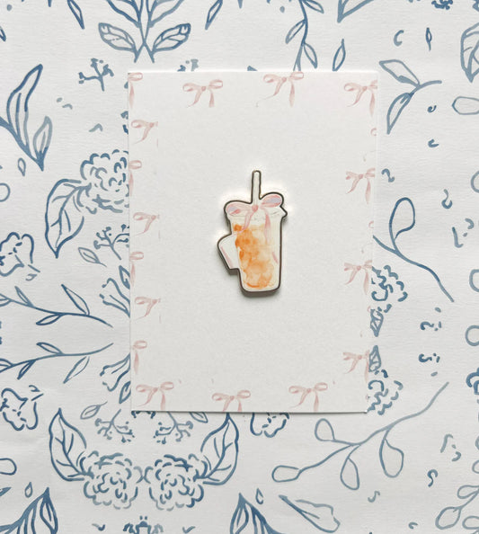 Iced coffee with bow needle minder