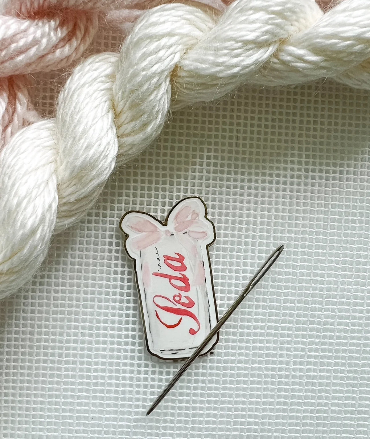 diet soda with bow needle minder
