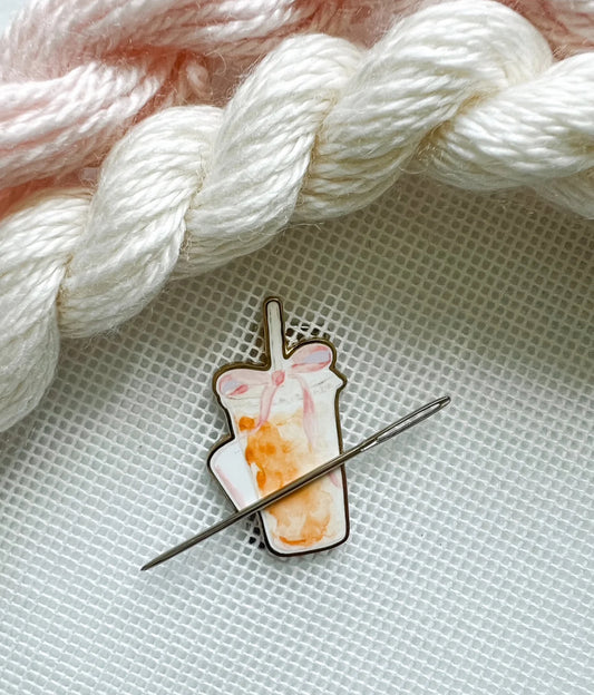 Iced coffee with bow needle minder